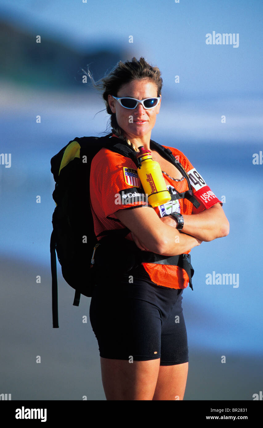 Portrait of female adventure racer on the beach in Zuma Beach ...