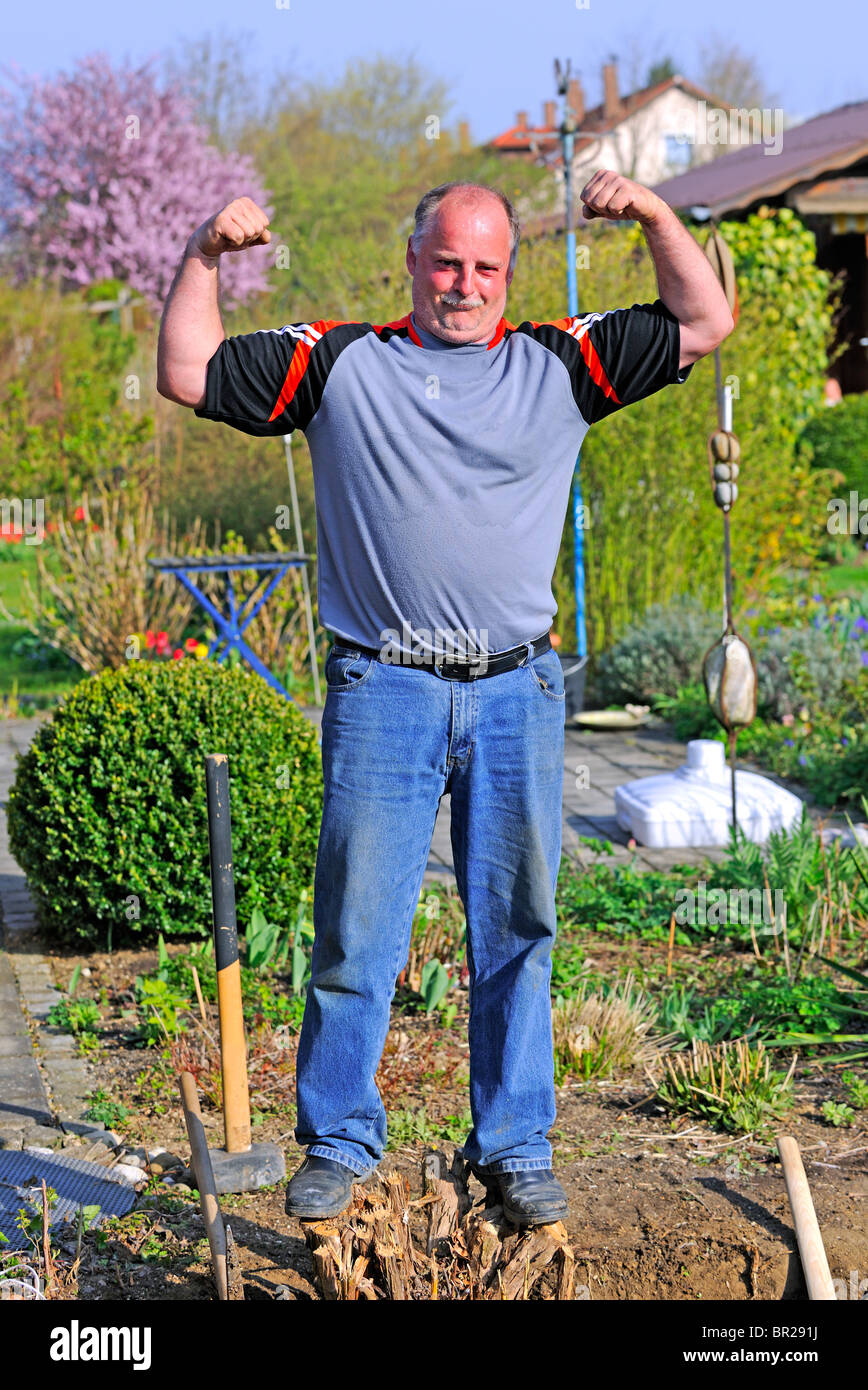 Mature Man showing his muscles Stock Photo