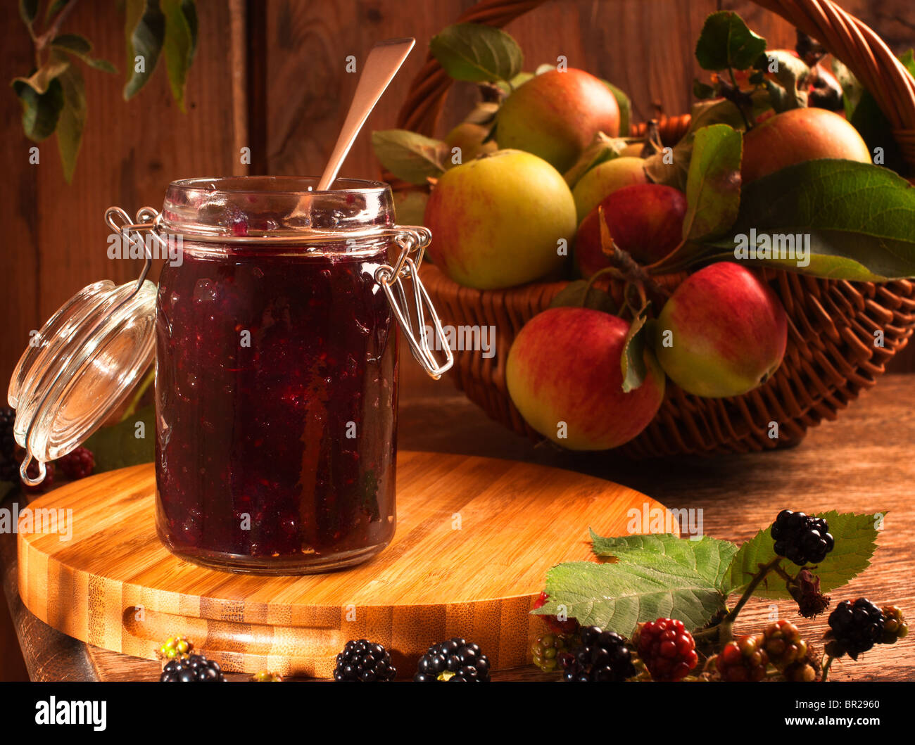 Blackberry & apple preserve in rustic country cottage setting Stock Photo