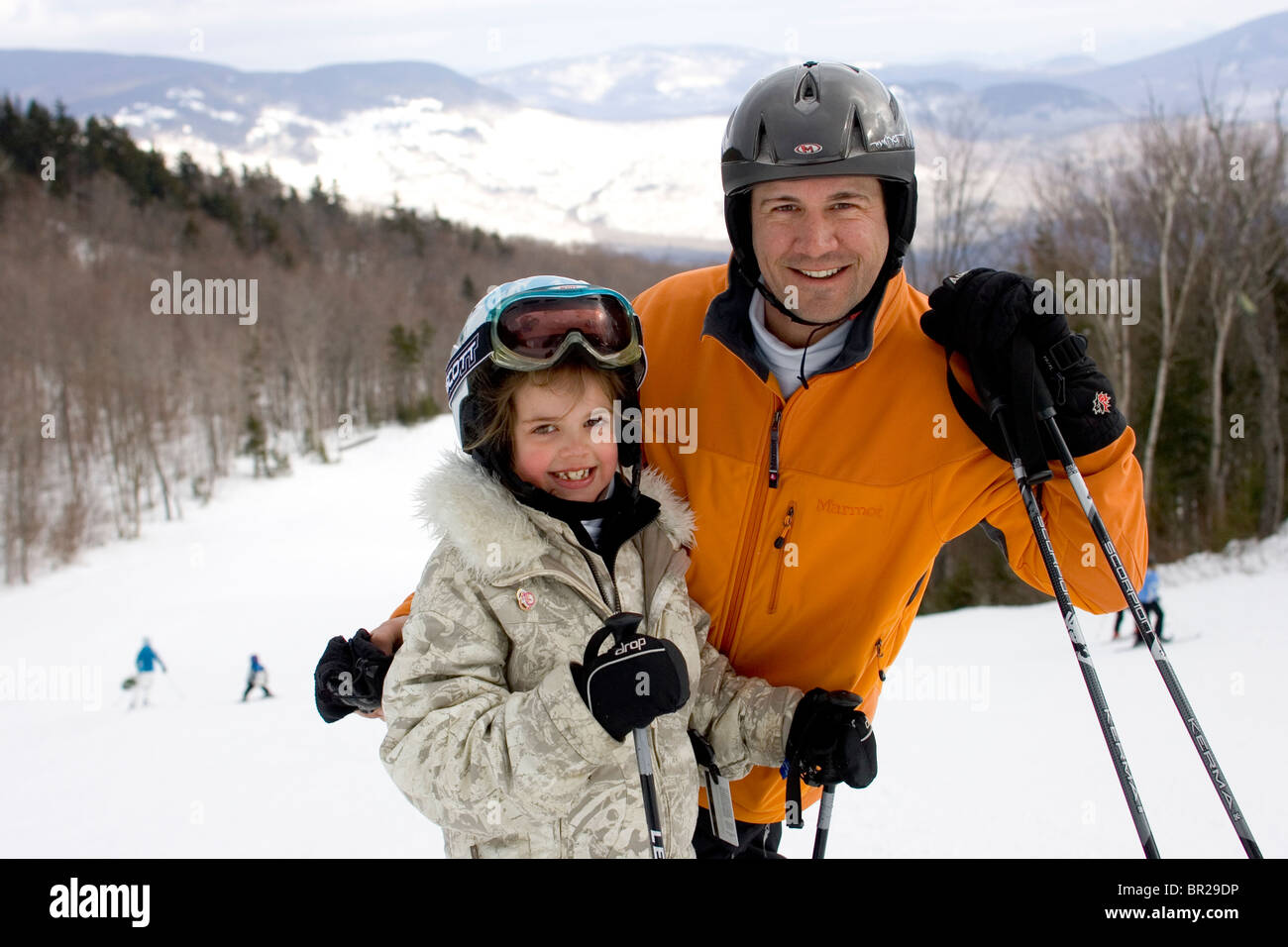 A father and daughter pose for a portrait while skiing in Newry, Maine. Stock Photo