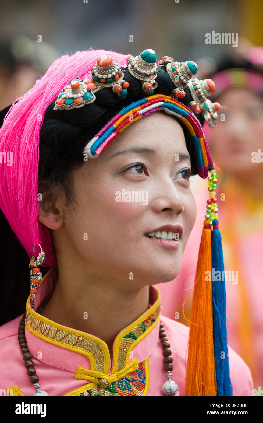 Ethnic Tibetan performer wears traditional costume at dance and folk festival, Danba, Sichuan Province, China Stock Photo