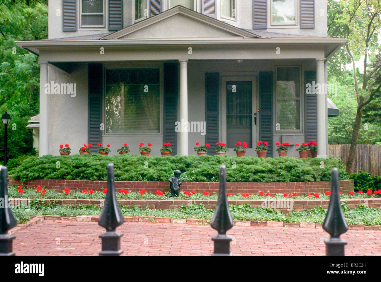 Detail Close Up Of Victorian House Painted Gray With Brick Patio