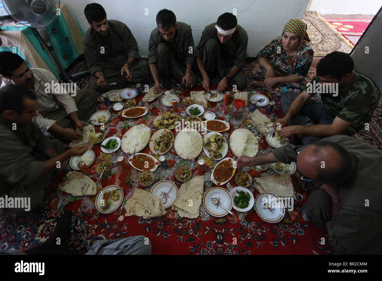 A group of Kurdish fighters of the People's Defense Forces HPG the military  wing of the Kurdistan Workers' Party PKK eating traditional Kurdish food in  a safe house in a rural settlement