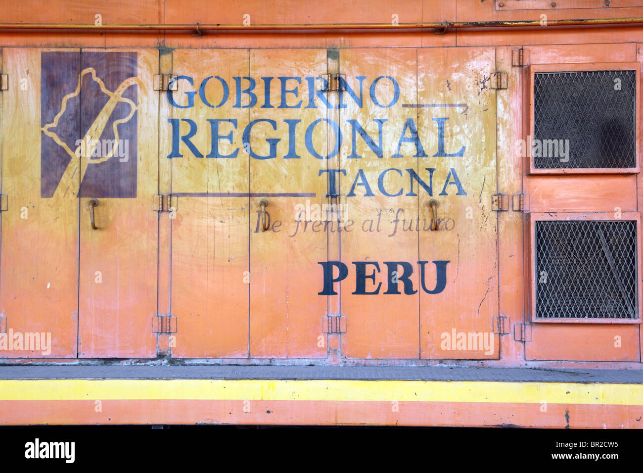 Tacna Regional Government logo on side of diesel engine in railway terminal, Tacna , Peru Stock Photo