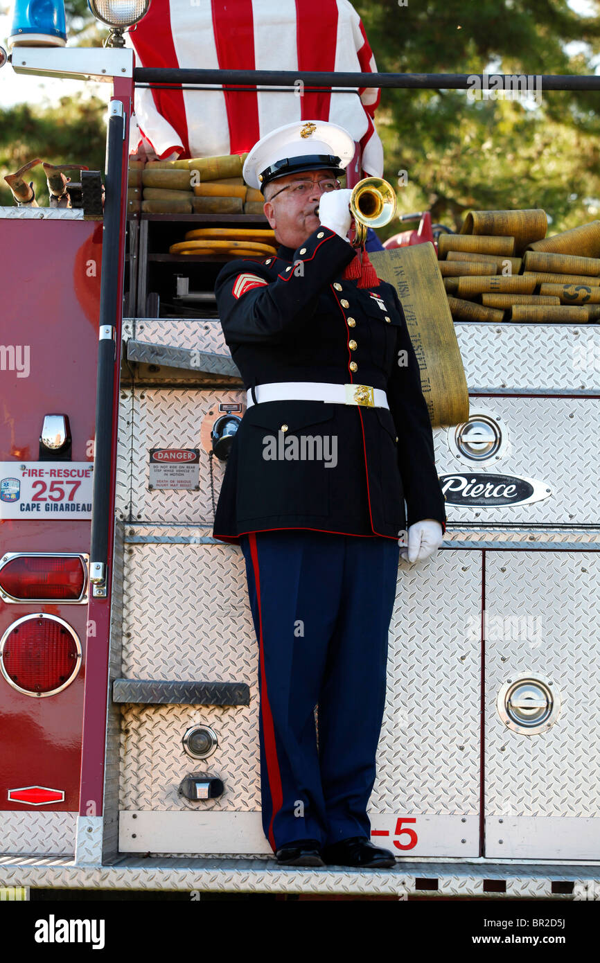 Cpl. Bob Francis plays the bugle during the closing ceremony of Saturday's vigil in remembrance of Sept. 11, 2001. Stock Photo