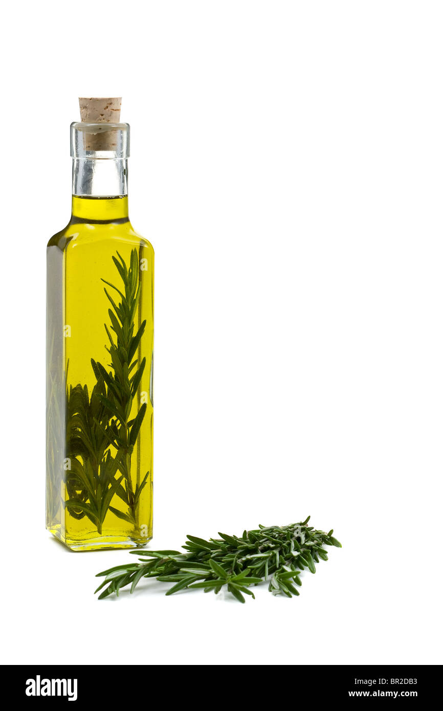 Rosemary infused olive oil over white background Stock Photo Alamy