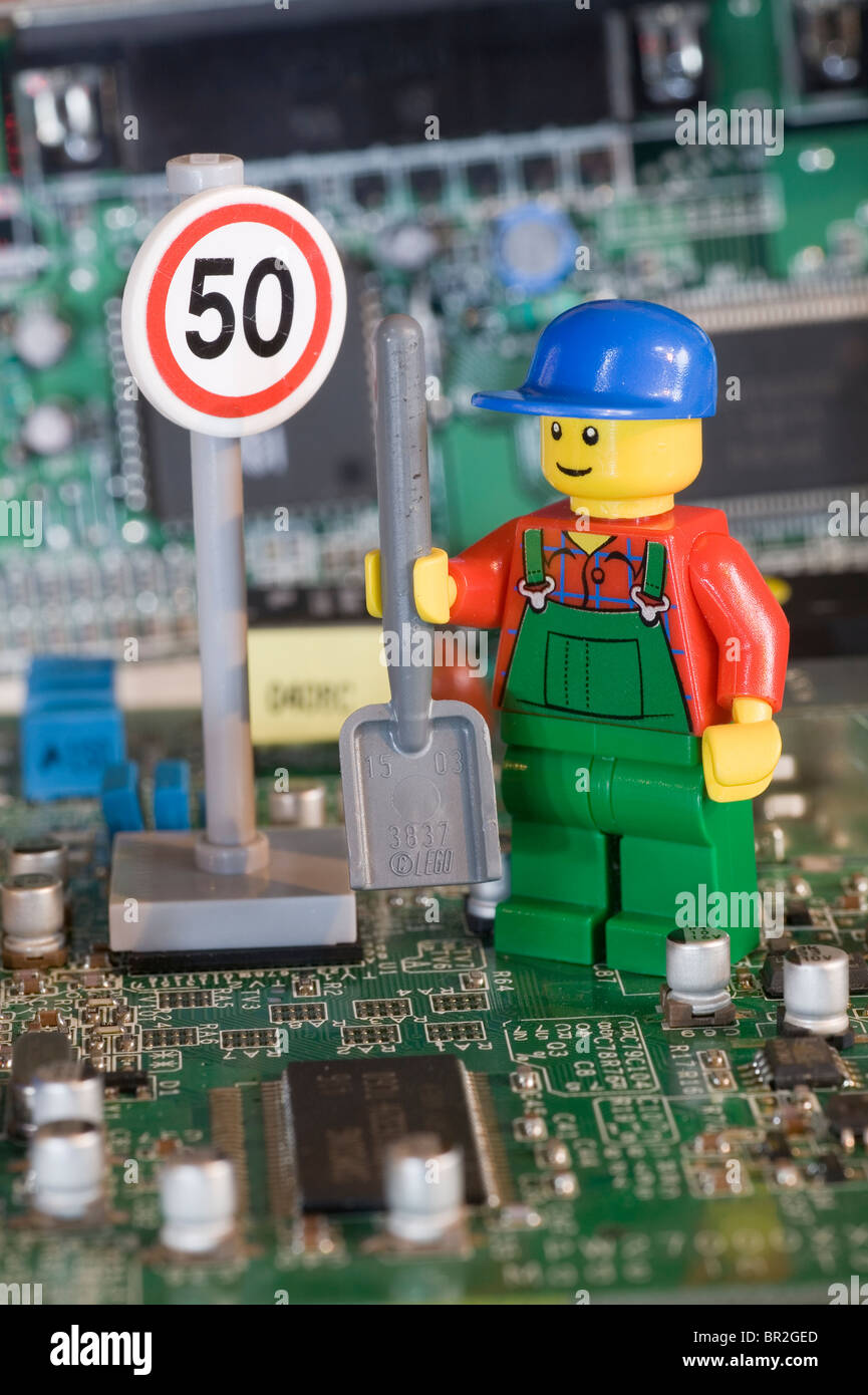 Lego workman about to work on the Information Super Highway Stock
