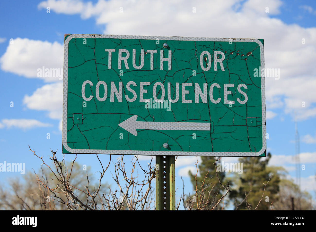 Road sign in rural New Mexico for the town of Truth or Consequences. Stock Photo
