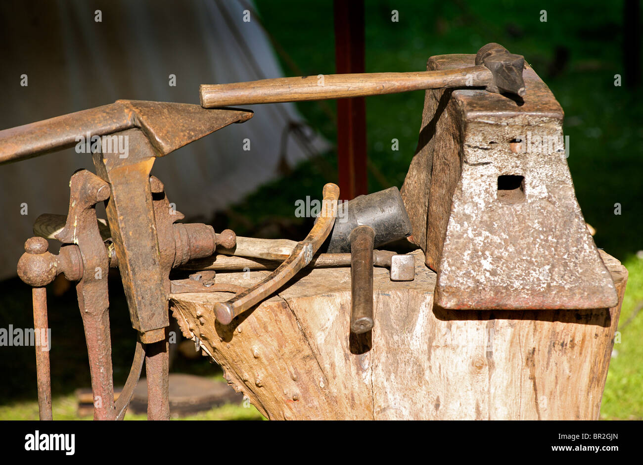 The tools of a blacksmith. Anvil and hammers Stock Photo