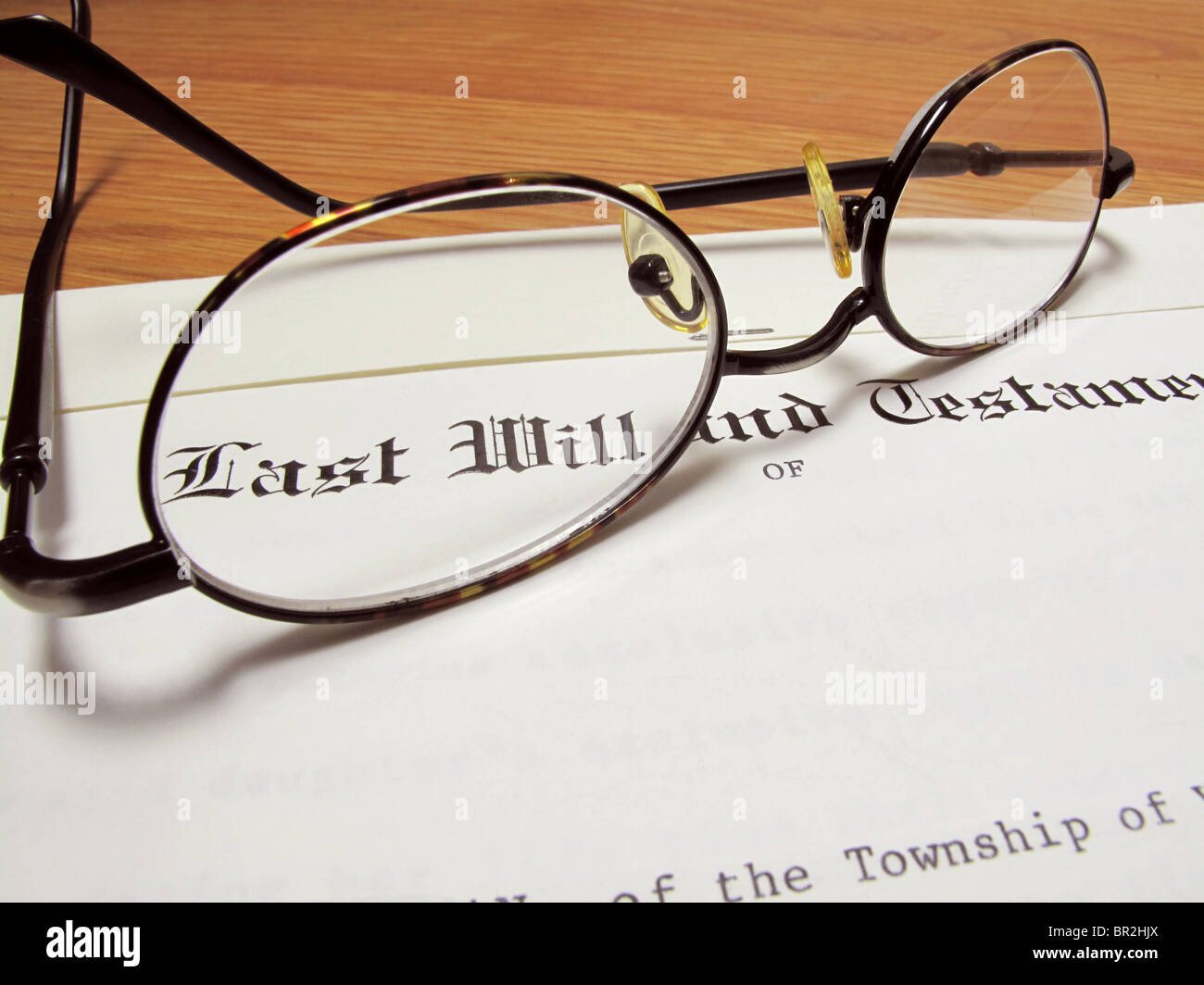 Actual last will and testament with eyeglasses on wooden desk Stock Photo