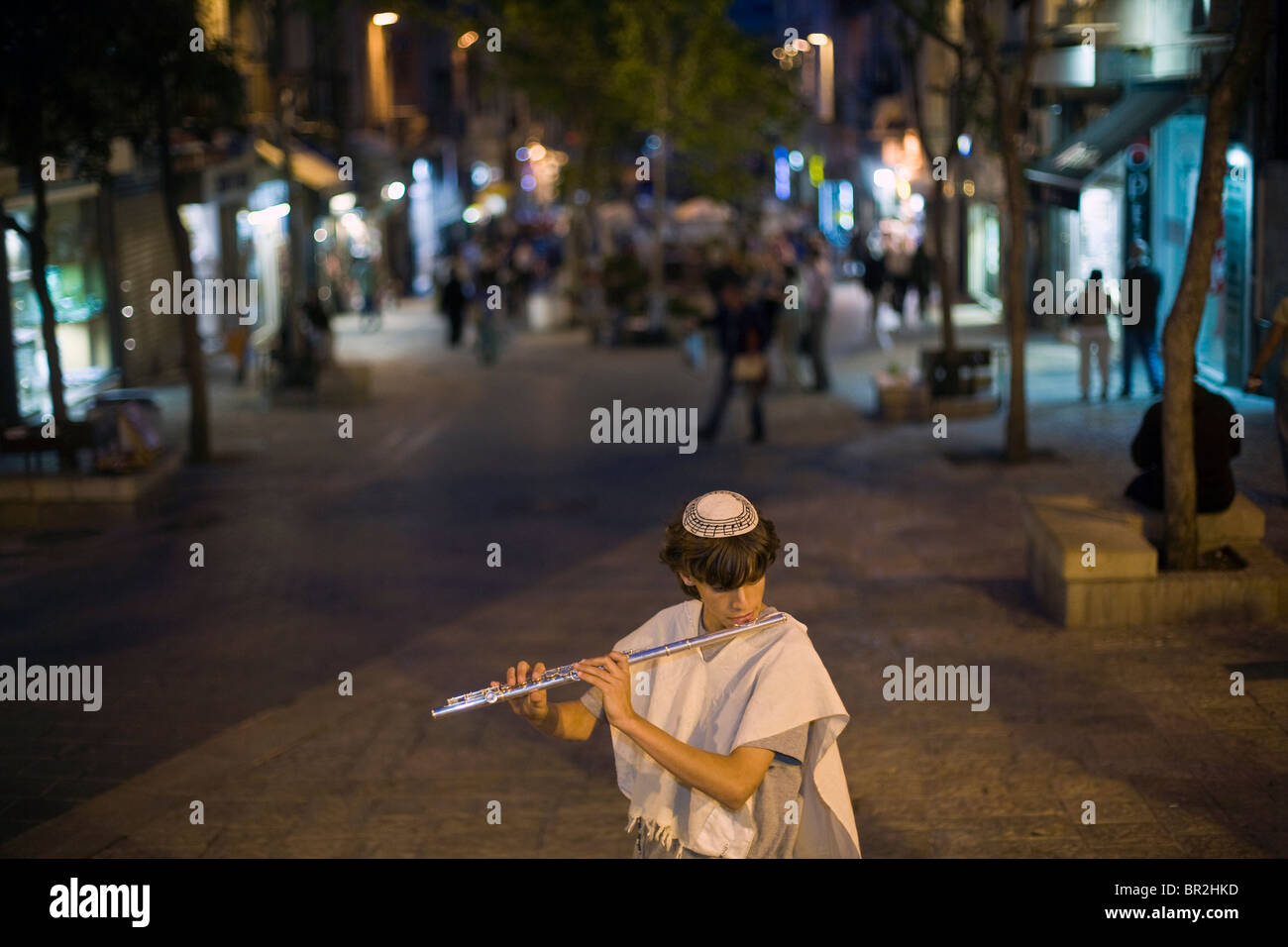 Boys dressed in traditional Israeli and Jewish clothes play the flute and mandolin on Ben Yahuda Street, Jerusalem, Israel Stock Photo