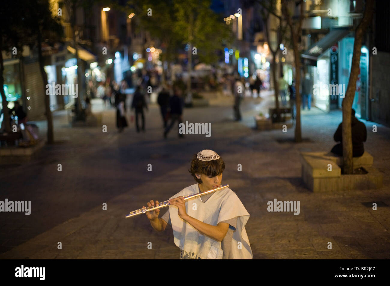 Boys dressed in traditional Israeli and Jewish clothes play the flute and mandolin on Ben Yahuda Street, Jerusalem, Israel Stock Photo