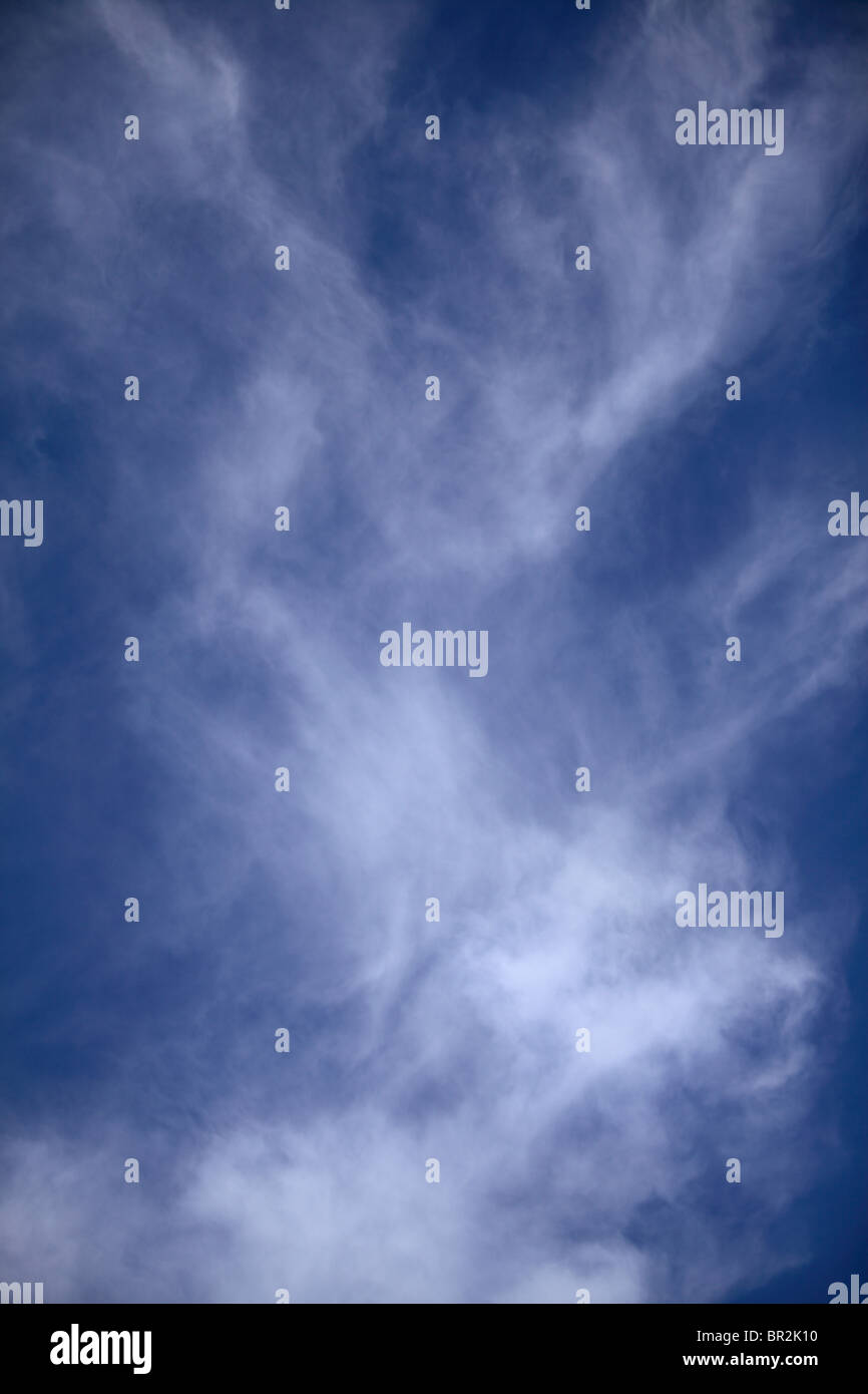 Wispy cirrus clouds on a summer evening Stock Photo