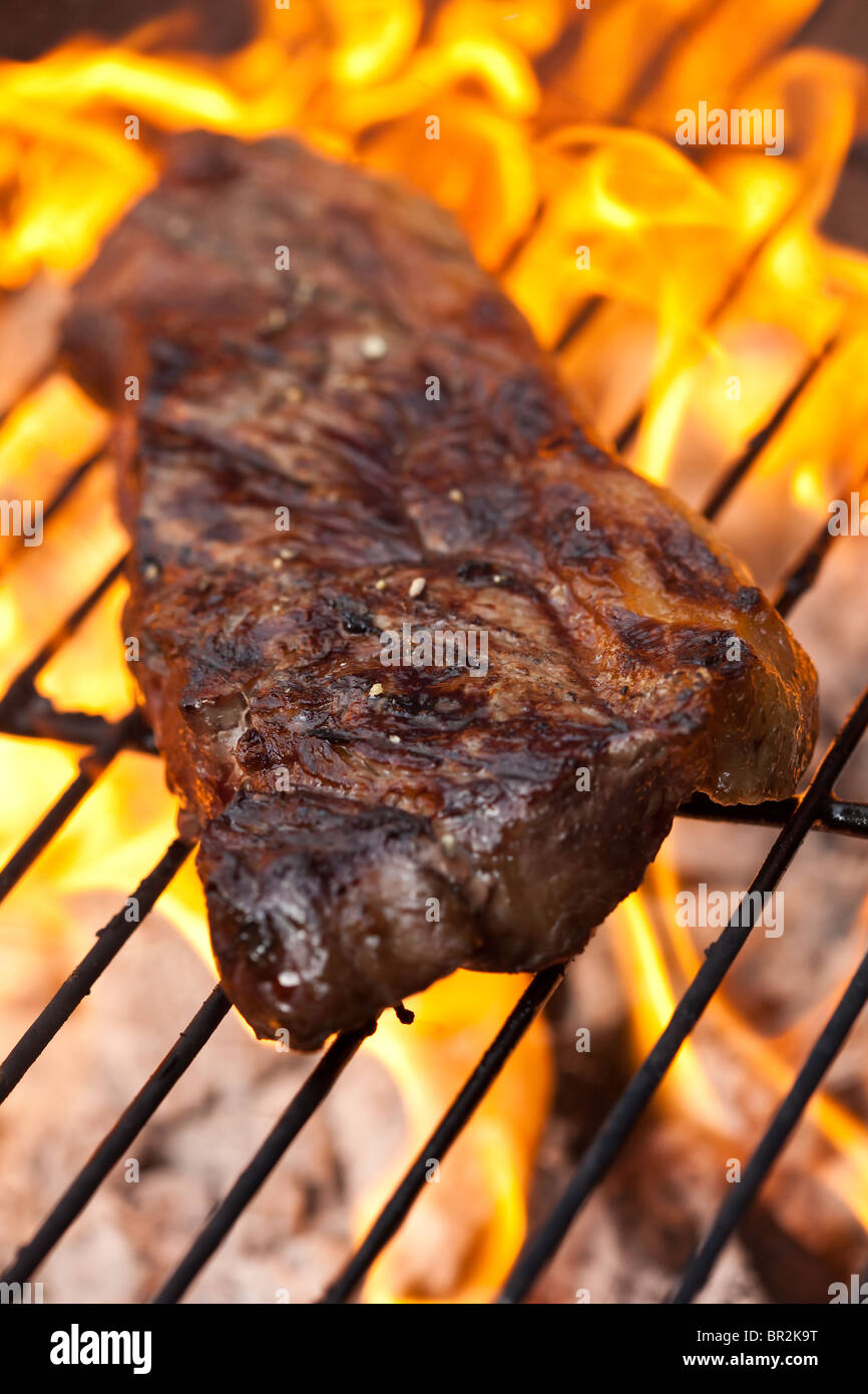 Flame grilled sirloin steak on a bbq Stock Photo