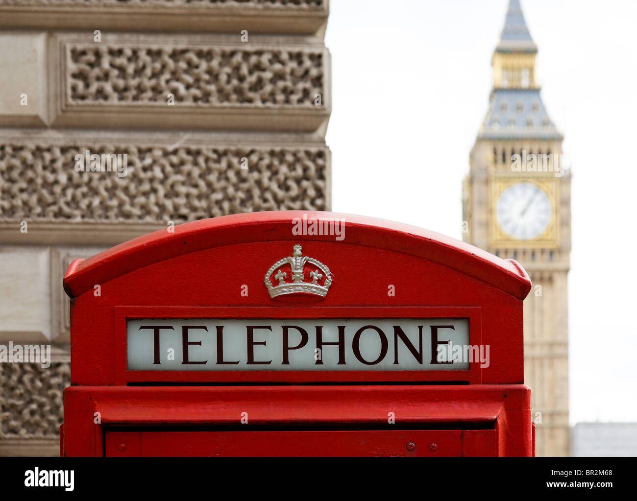 London telephone box with Big Ben in the background Stock Photo