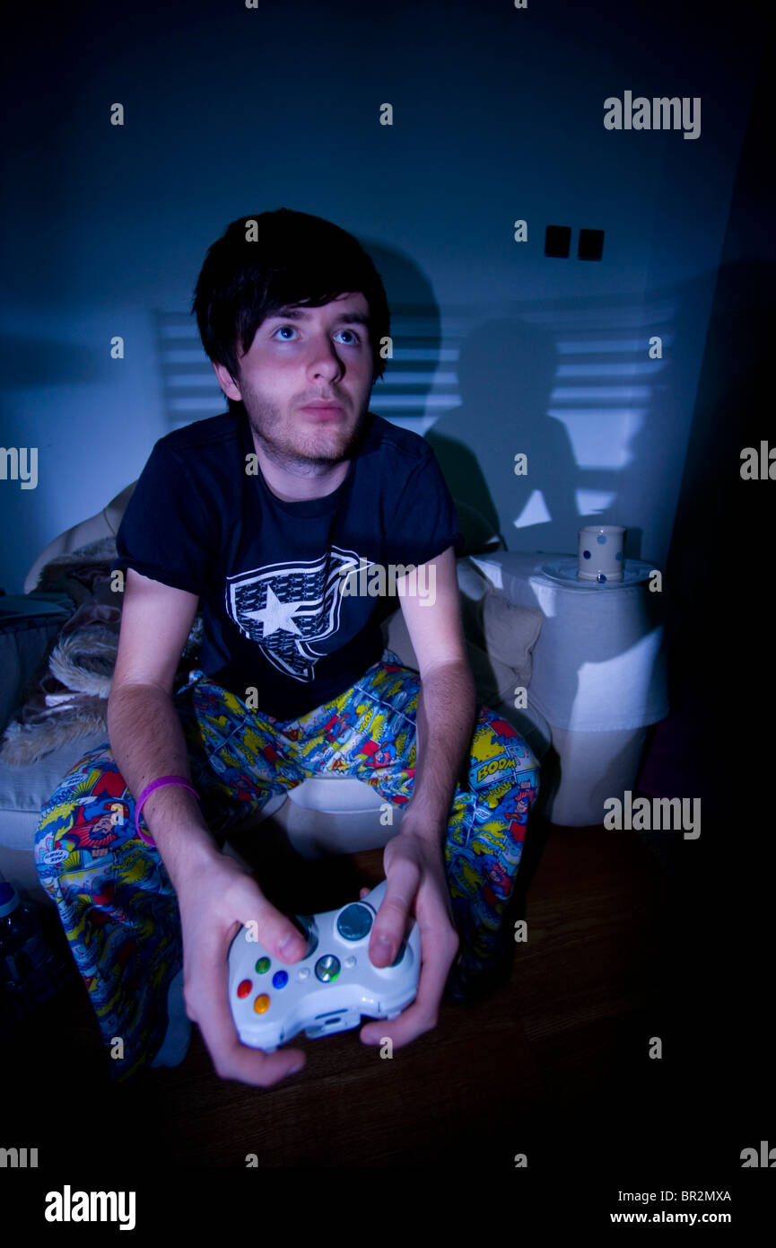 FILE--A young boy plays electronic games on an XBOX ONE game console at a  physical store of Microsoft in Shanghai, China, 26 December 2014. Produc  Stock Photo - Alamy