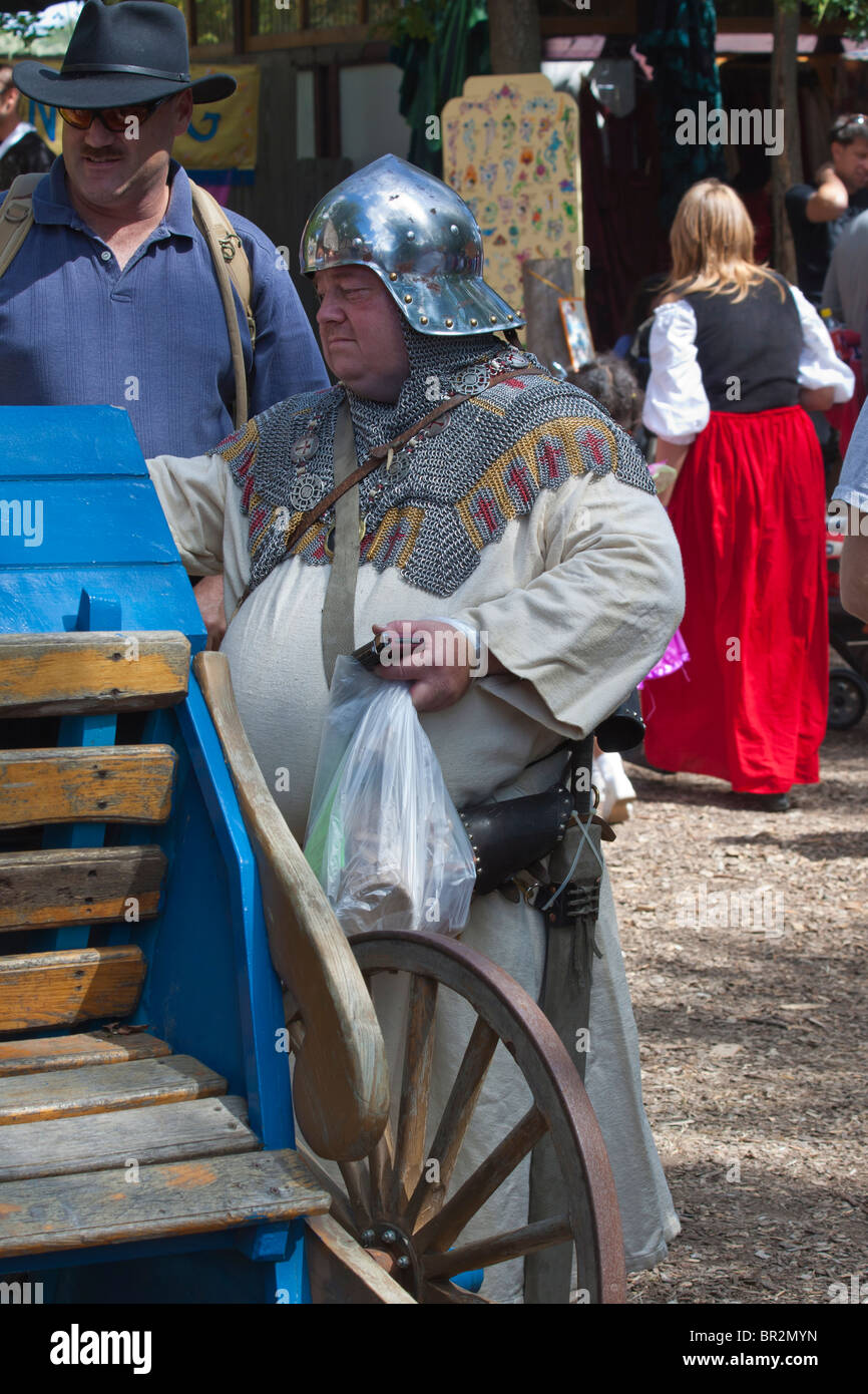 Renaissance festival in Michigan USA funny person in unusual dress on the street picture funny dress in public hi-res Stock Photo