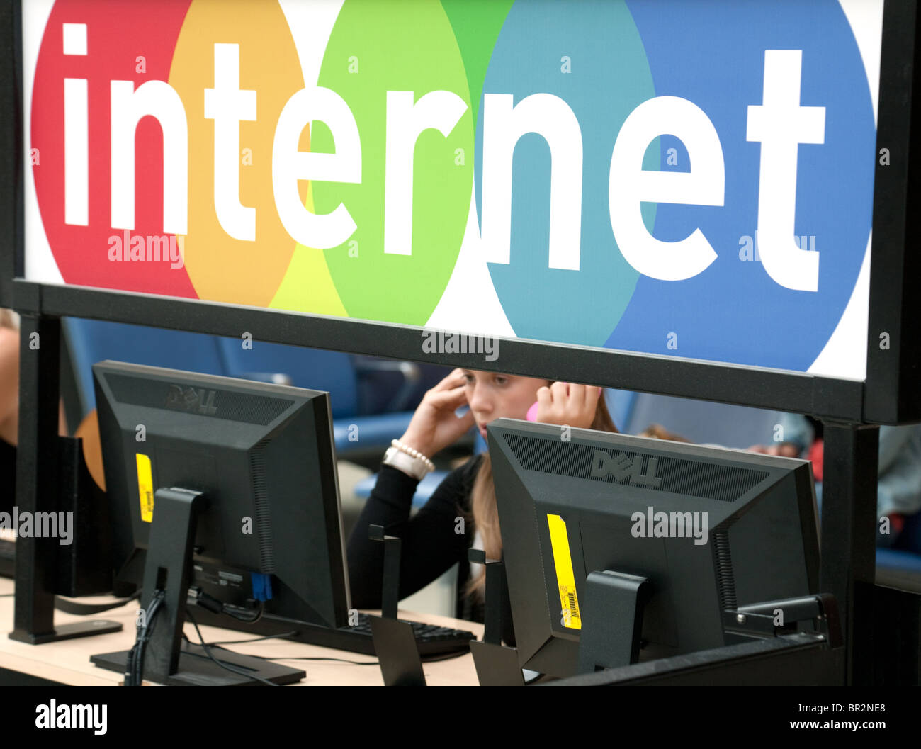 Traveller using the Internet at South terminal, Gatwick airport UK Stock Photo