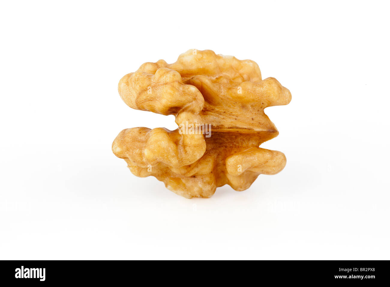Raw shelled walnut half on white background Stock Photo