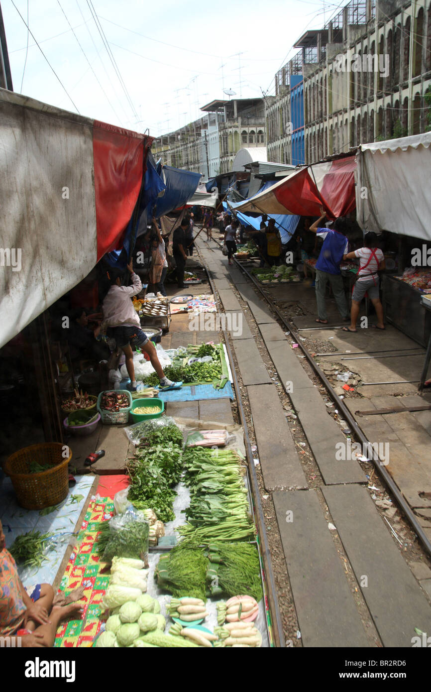 A food market on the rail tracks , Maeklong railway market , Thailand Stock Photo