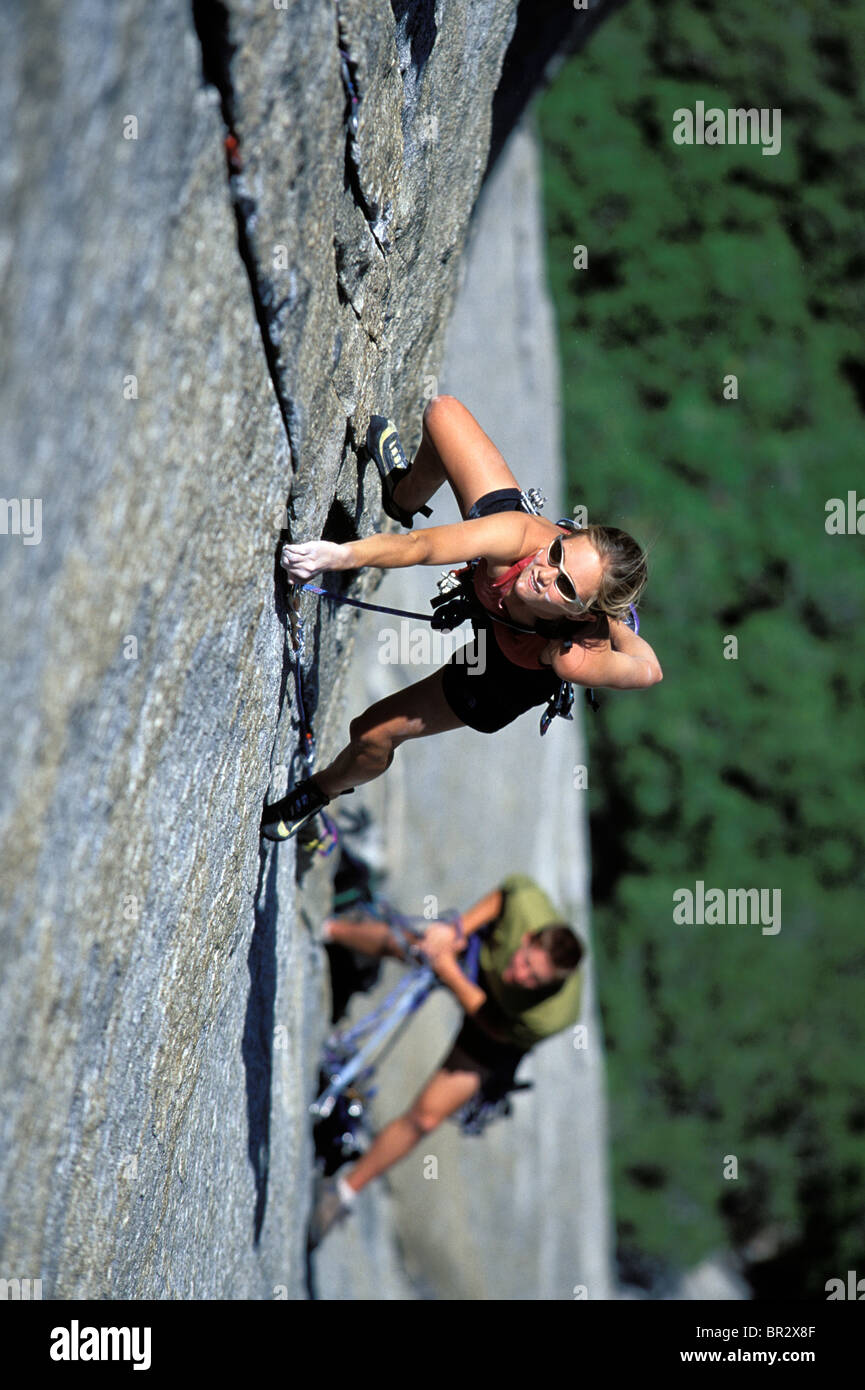 Woman lead climbing on a big wall (high angle perspective Stock Photo