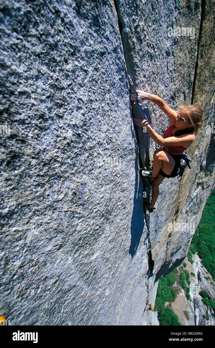 Woman lead climbing on a big wall (high angle perspective Stock Photo