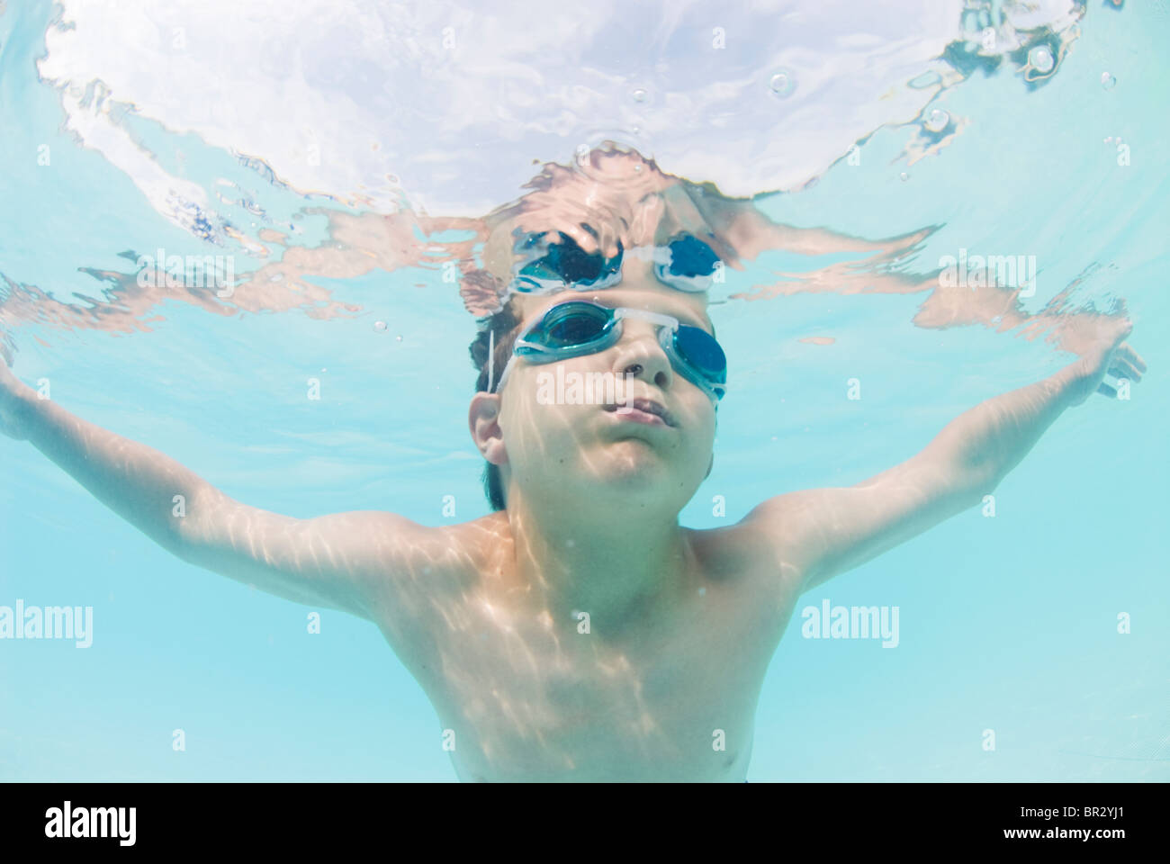 Boy swimming in outdoor pool hi-res stock photography and images - Alamy