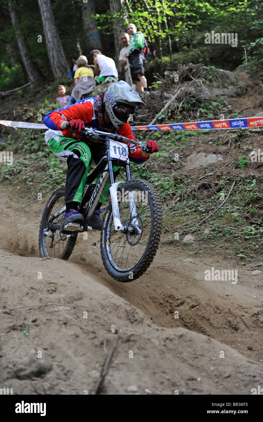 In the mountains of the Dolomites in Italy. Mountainbike downhill competition at the ski lift station of Commezzadura. Stock Photo