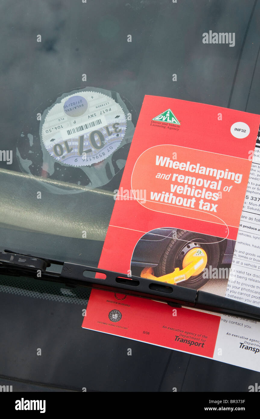 Expired tax disc and DVLA information leaflet on illegal, untaxed and