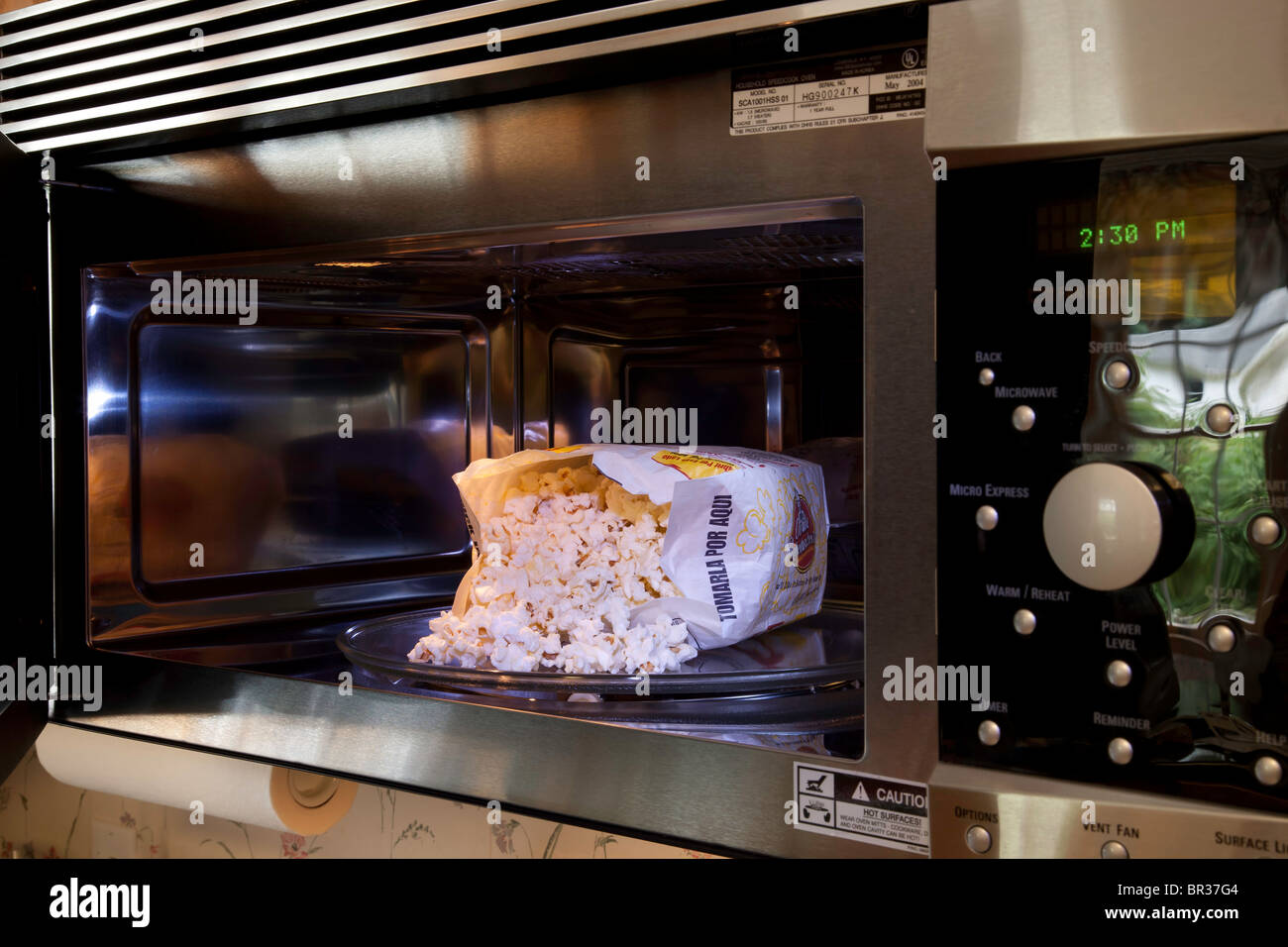 Microwave Oven and Popcorn Stock Photo
