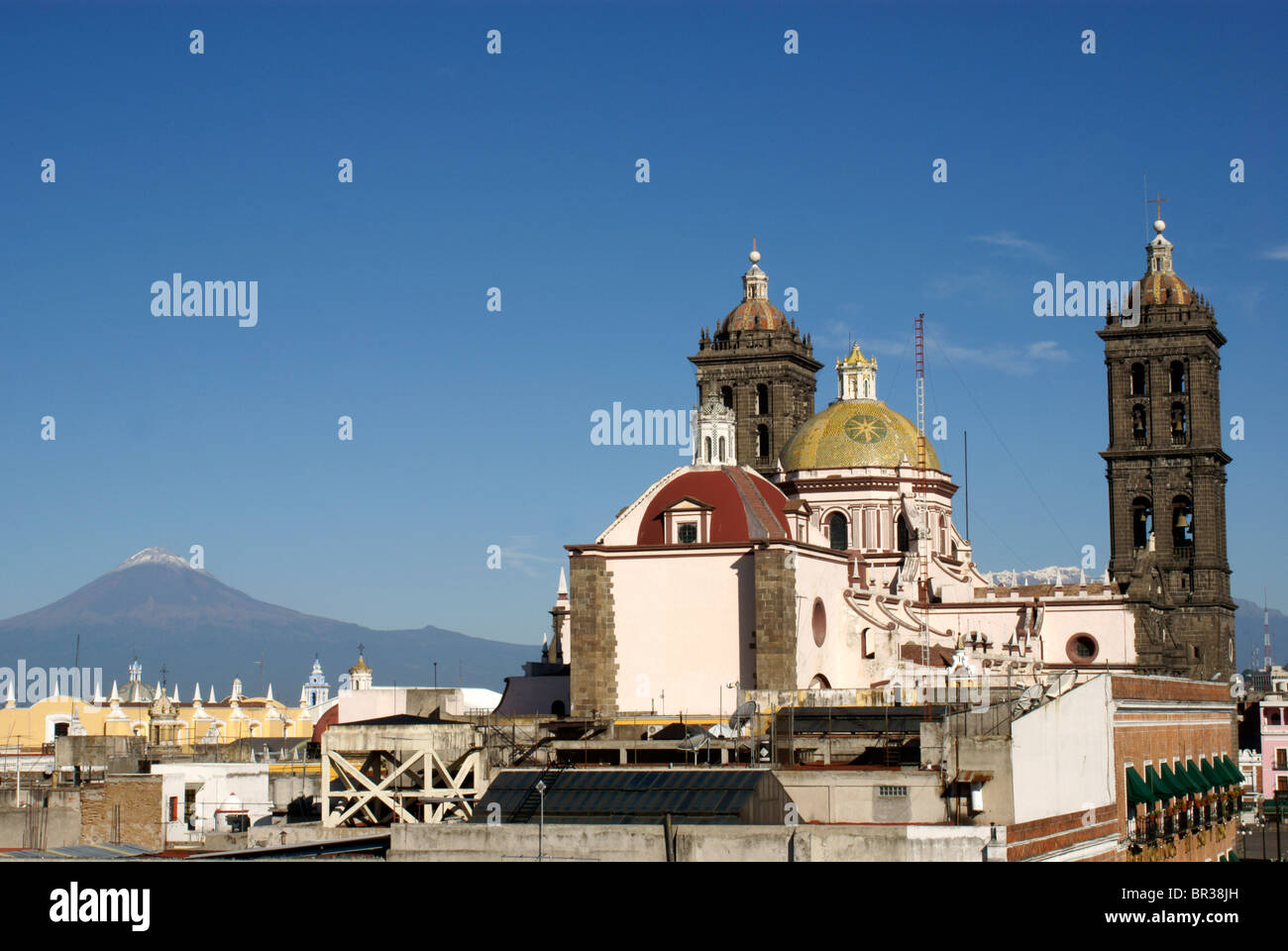 Rear view of the Cathedral of the Immaculate Conception with  Popocatepetal Volcano in the background, city of Puebla, Mexico Stock Photo