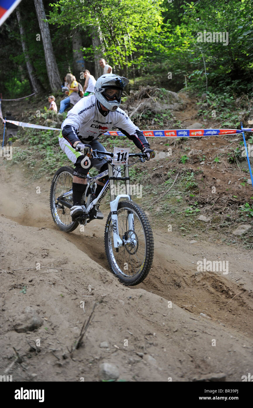 In the mountains of the Dolomites in Italy. Mountainbike downhill competition at the ski lift station of Commezzadura. Stock Photo