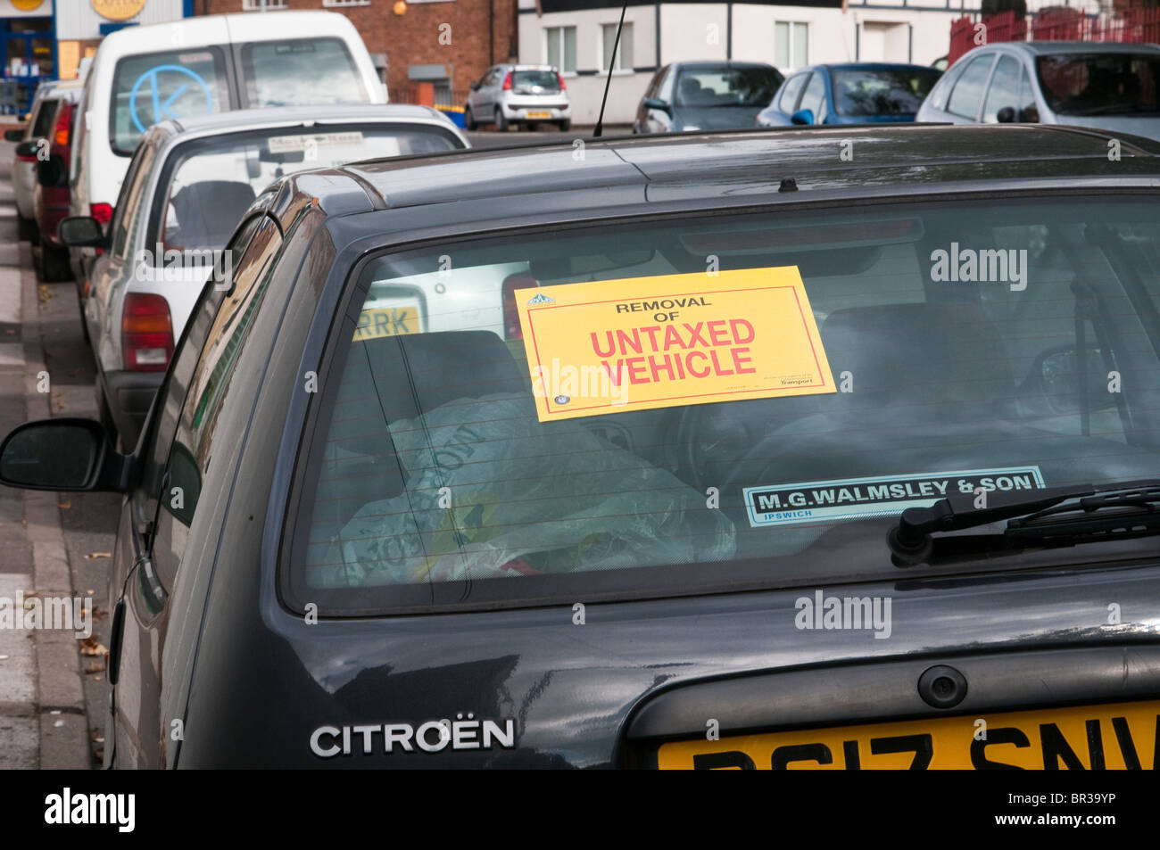 Illegal, untaxed and wheel clamped car in public street Stock Photo Alamy