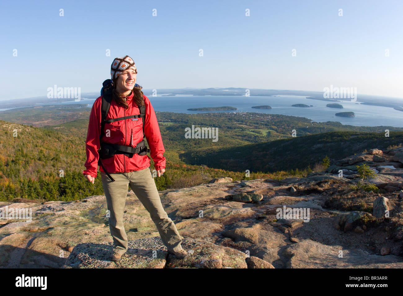 Young woman hiking on Cadillac Mountain in Acadia National Park. Bar