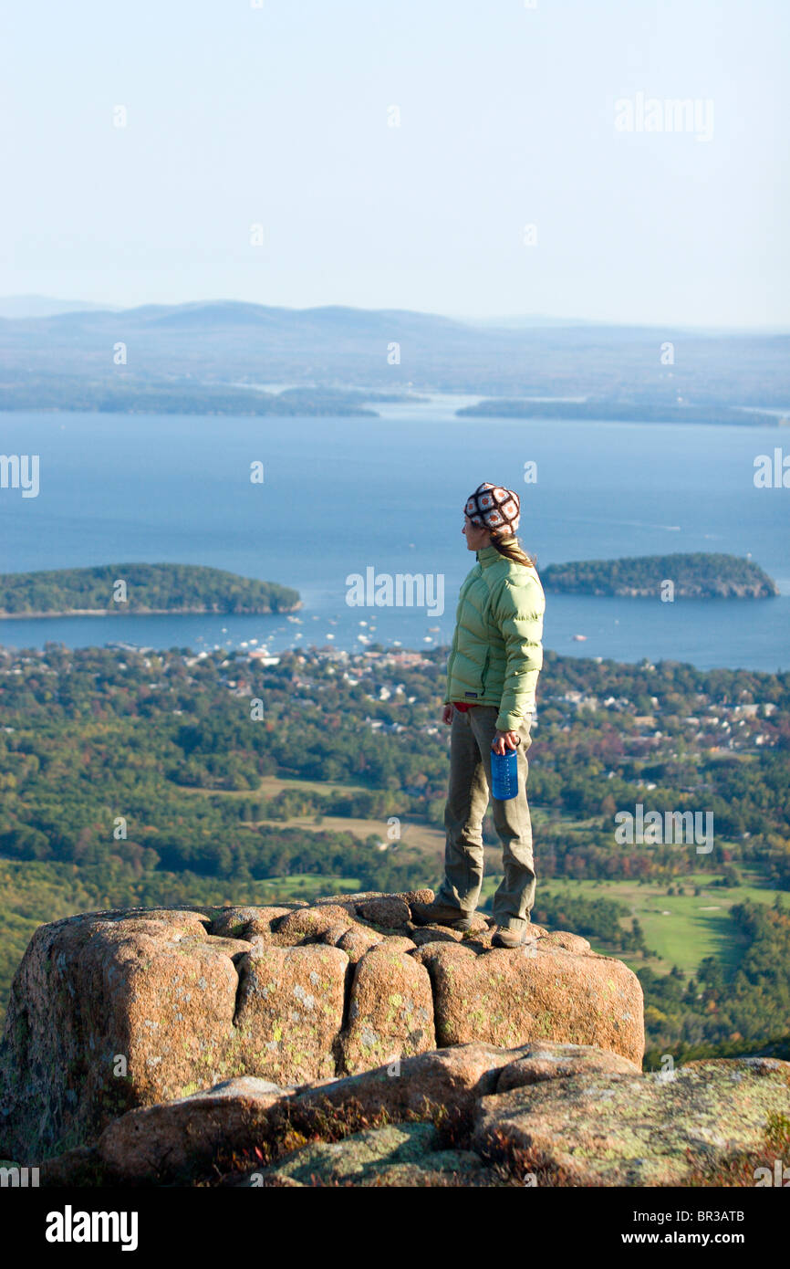 Young woman hiking on Cadillac Mountain in Acadia National Park. Bar
