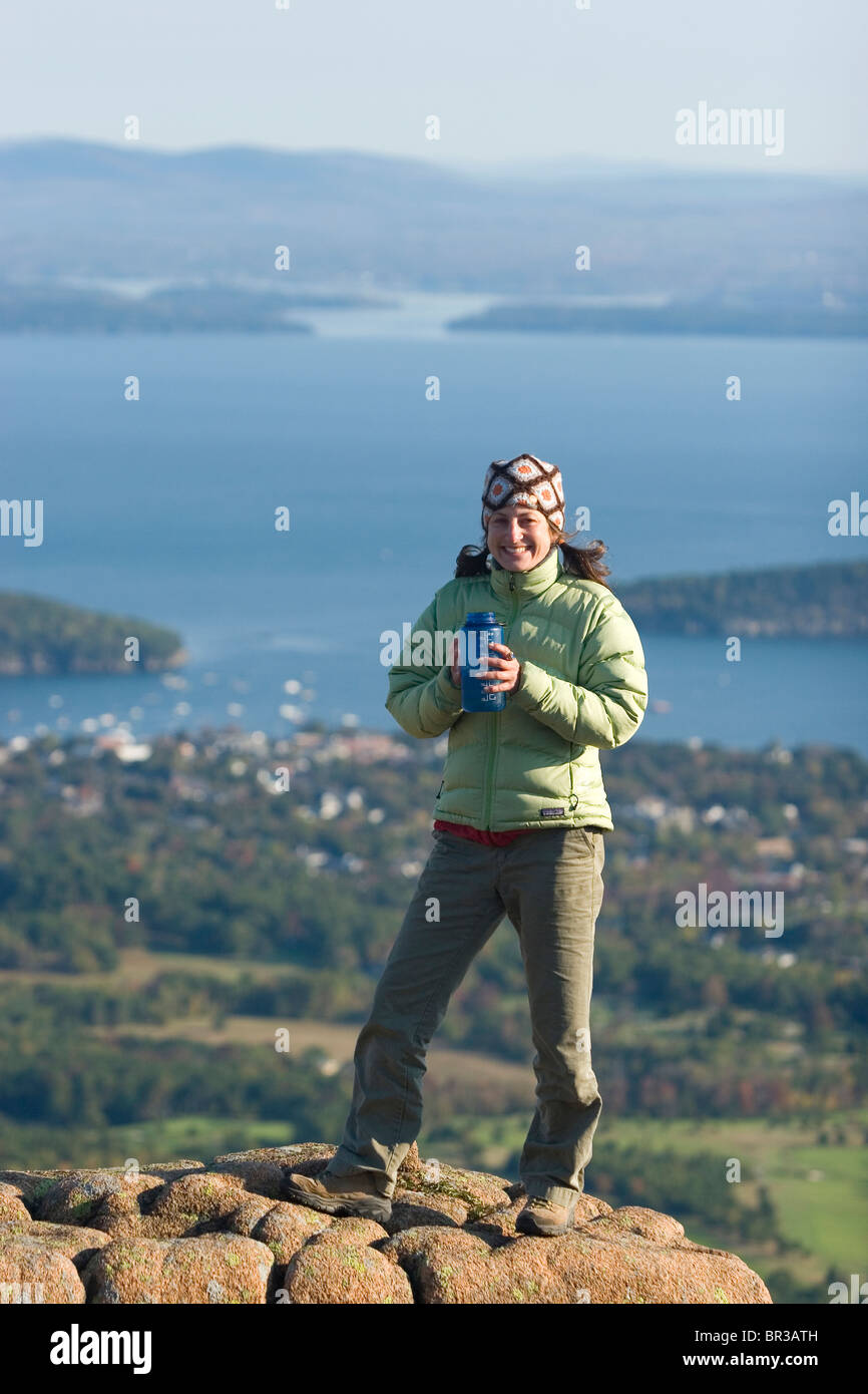 Young woman hiking on Cadillac Mountain in Acadia National Park. Bar