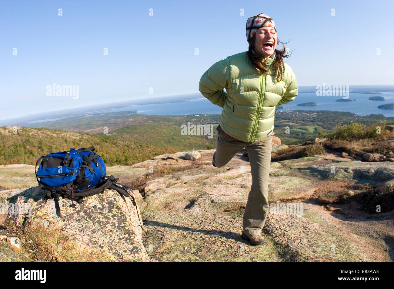 Young woman hiking on Cadillac Mountain in Acadia National Park. Bar