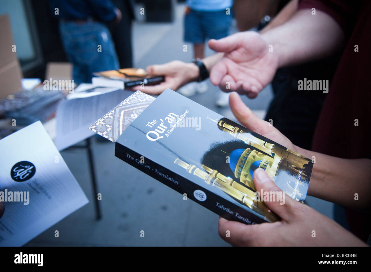 Muslims give away free Korans on a street in lower Manhattan Stock Photo