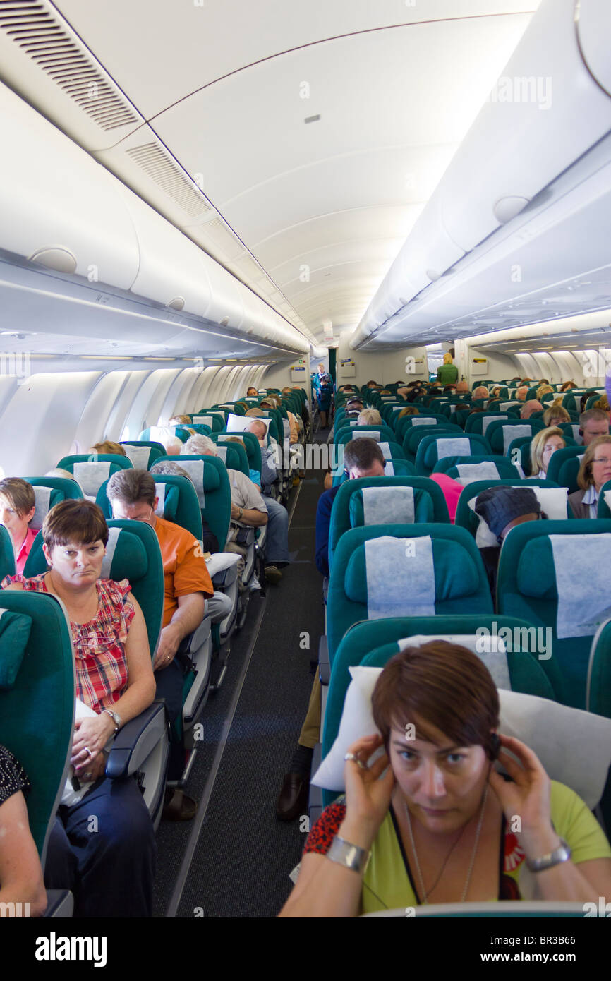 passengers in economy class cabin,  Aer Lingus flight Stock Photo