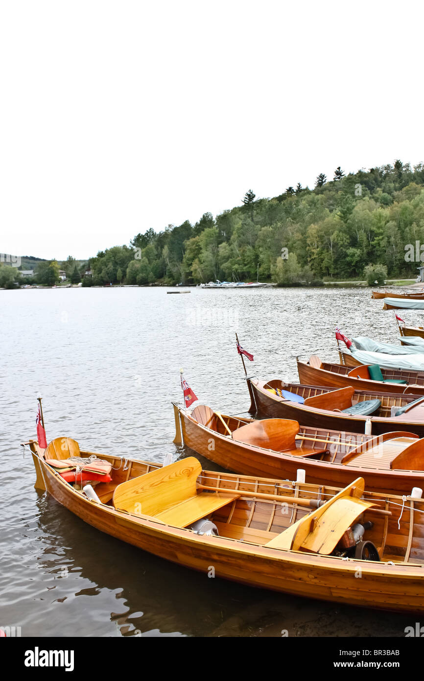 boat boats canoe canoes park water deck cottage Stock Photo