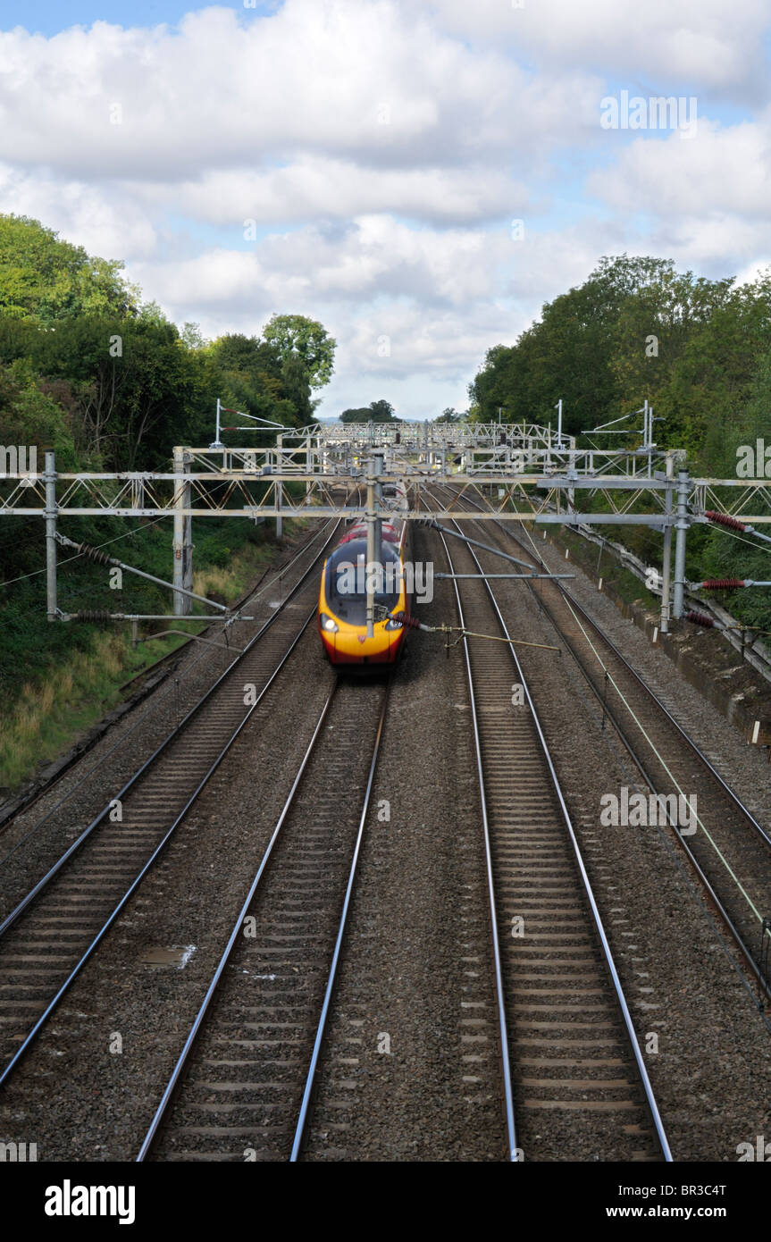 Virgin Pendolino train heading south toward London Euston, UK. Stock Photo