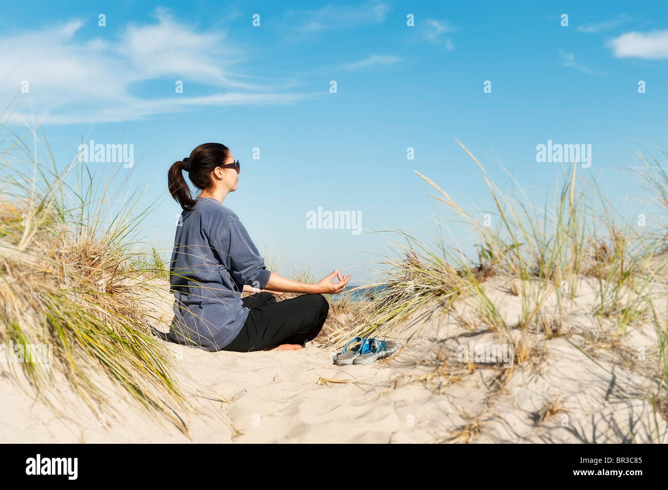 Woman practicing yoga at the beach, Cape Cod Stock Photo Alamy