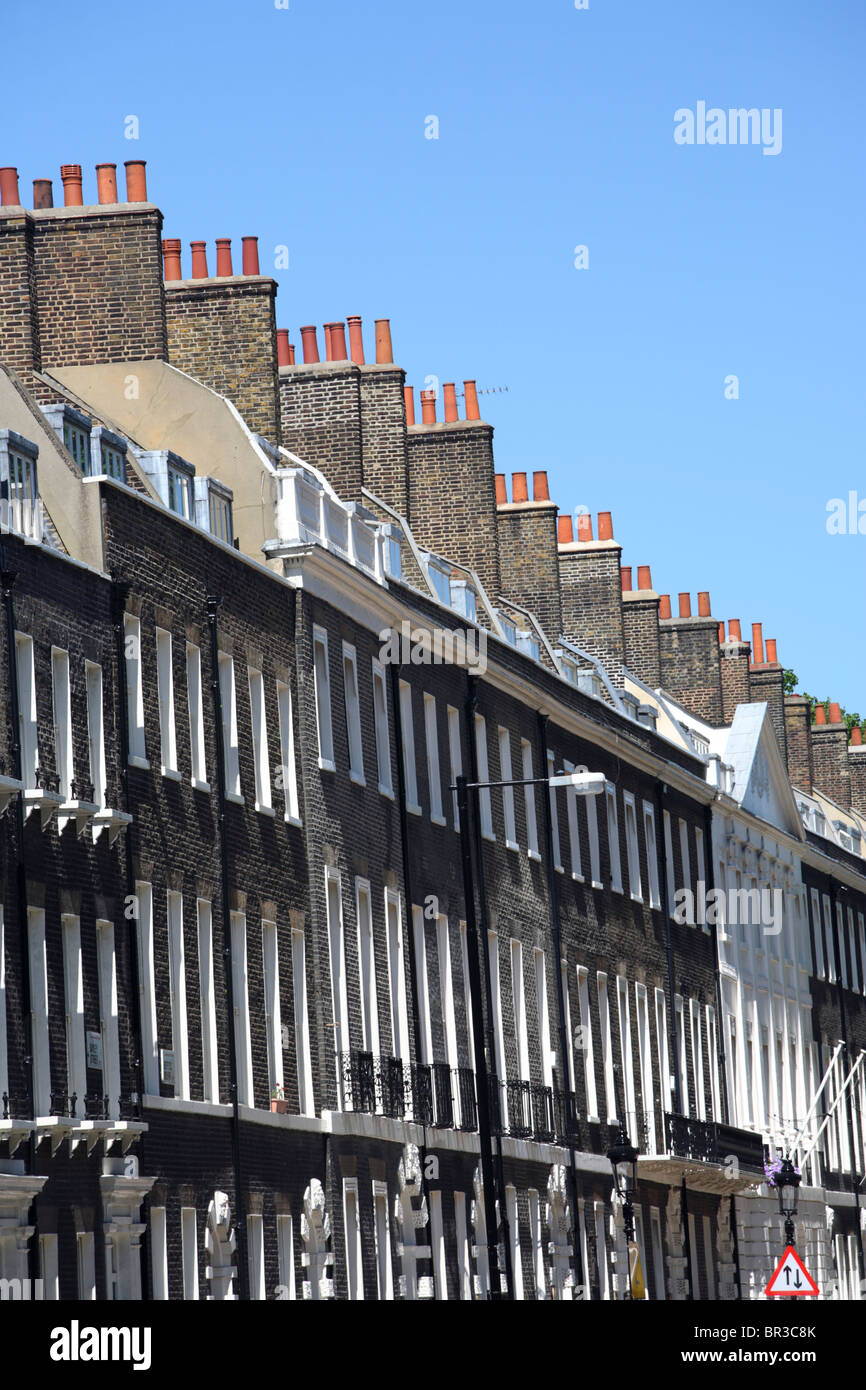 A foreshortened view of houses in Bayley Street from Tottenham Court Road, Westminster, London