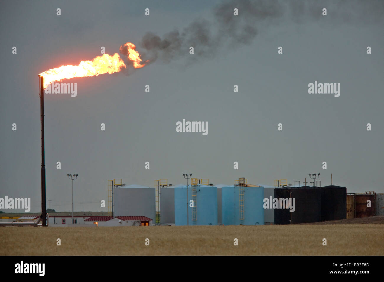 Oil Field flame burn off gas oil jack well pump Stock Photo Alamy