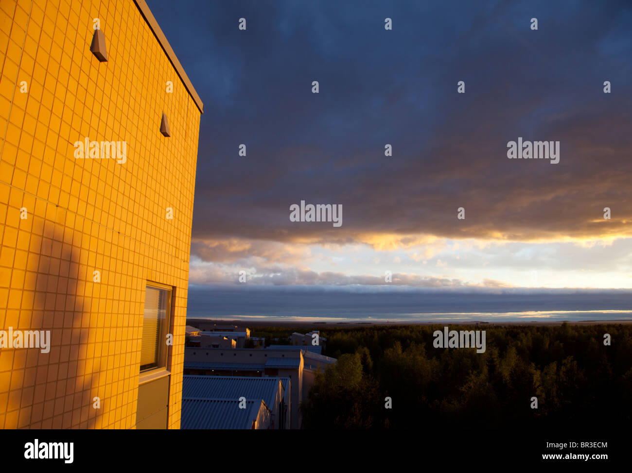 Last rays of the sun illuminate the block of flats wall , Finland Stock ...