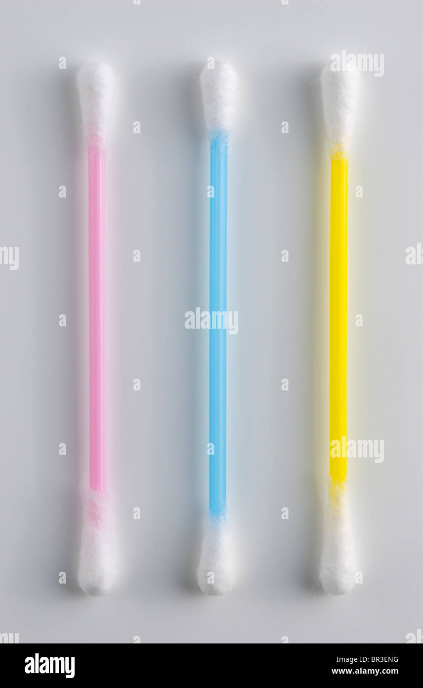 3 colorful plastic Qtips / cotton buds on white Stock Photo Alamy