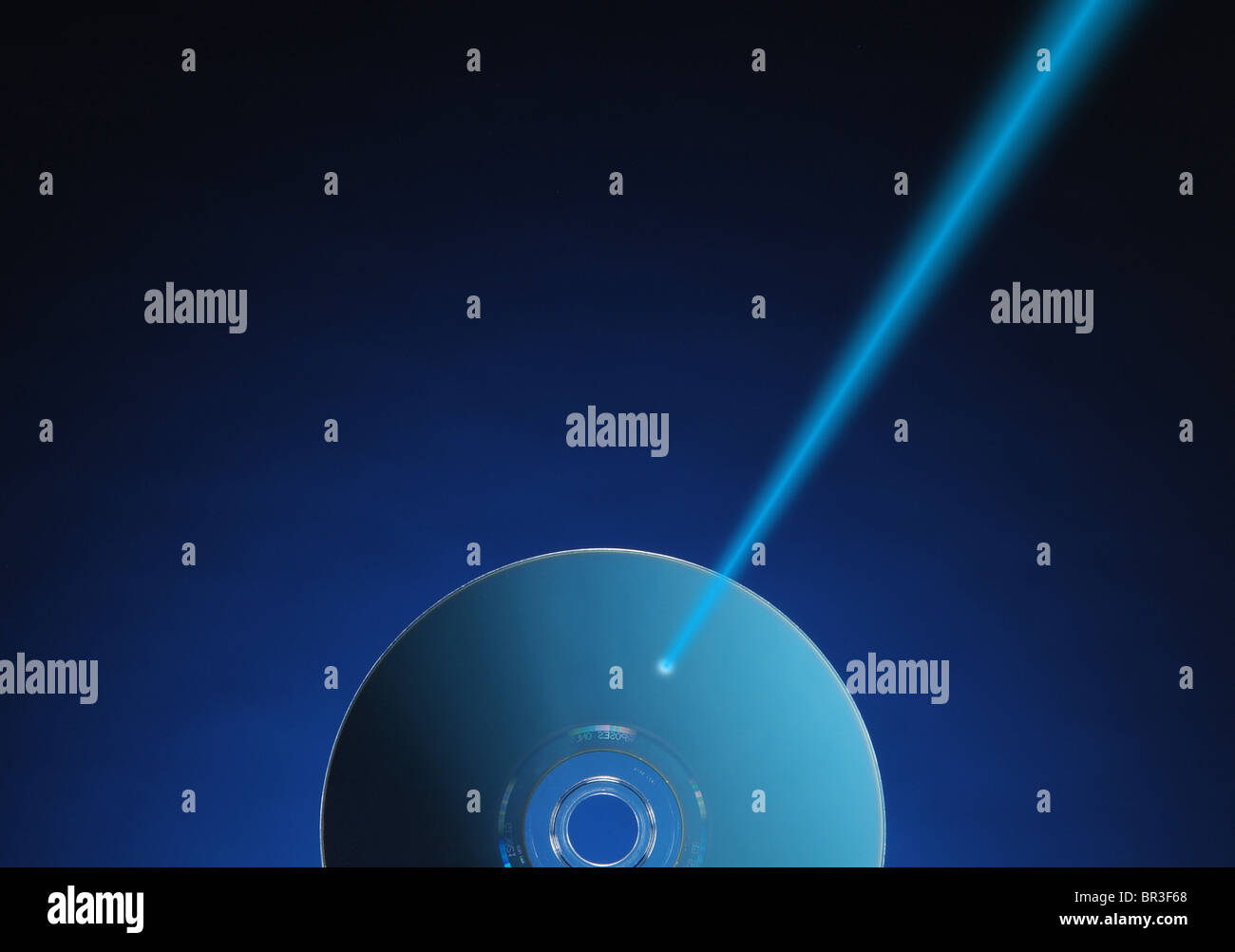 Laser beam puncturing a CD Stock Photo Alamy