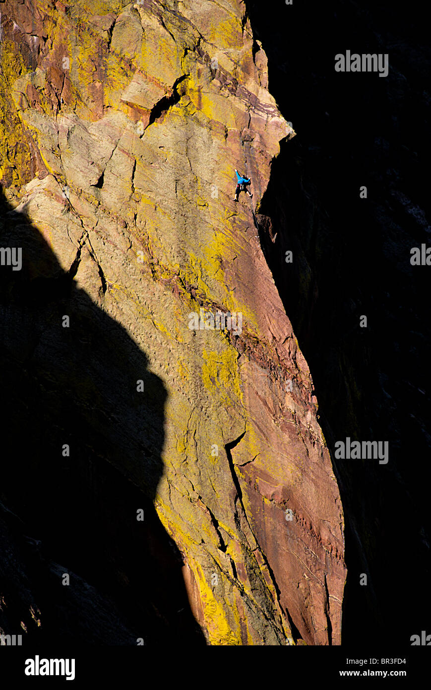A climber on a rock wall in Eldorado Canyon, Colorado Stock Photo