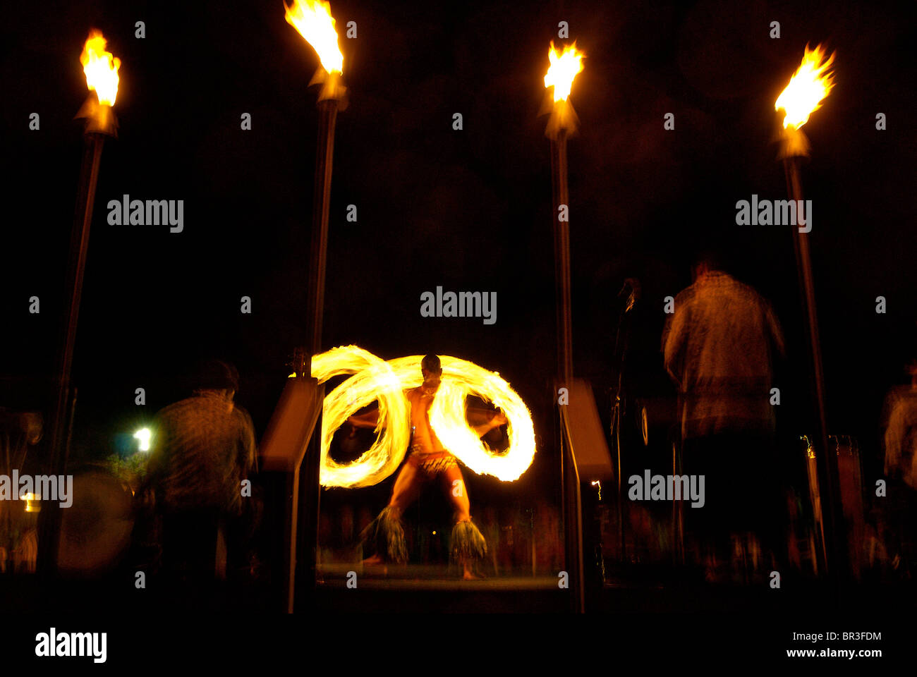 A man performs at a luau on the island of Maui, Hawaii. (motion blur). Stock Photo