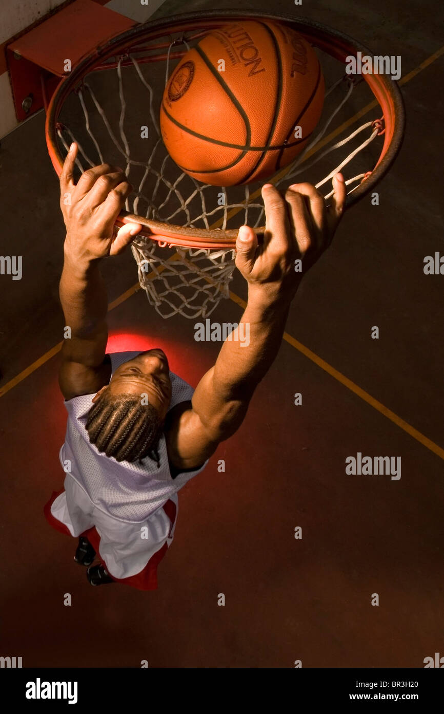 Clark College basketball player Markeith Brown slam dunks ball in Portland, Oregon. Stock Photo